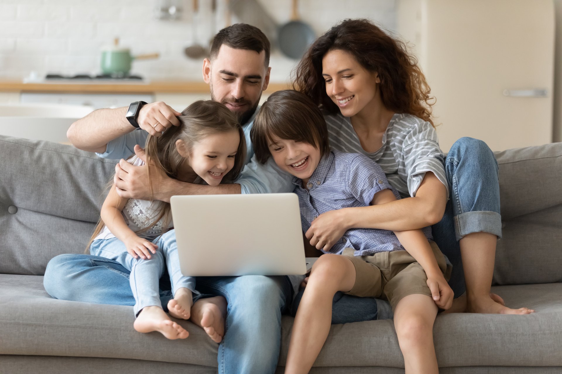 Family-with-kids-spend-time-together-using-laptop-websites-1198401598_6720x4480